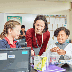 Renbrook School STEM teacher with two students engaged in science fair project