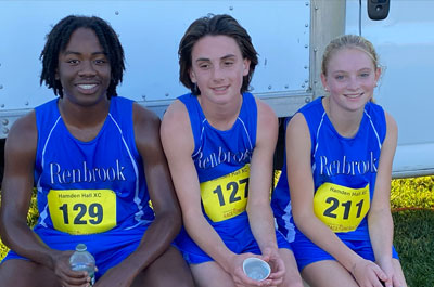 three cross country runners post race