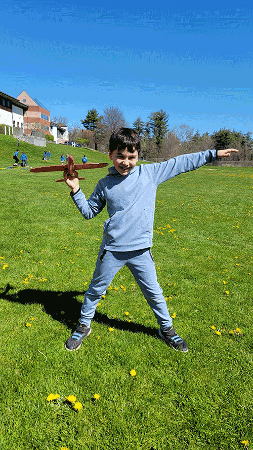Boy getting ready to fly miniature airplane