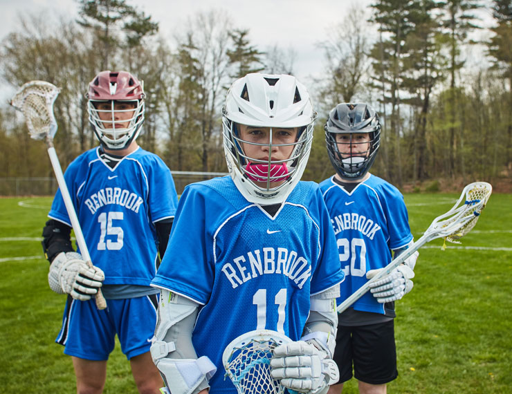 three middle school male lacrosse players
