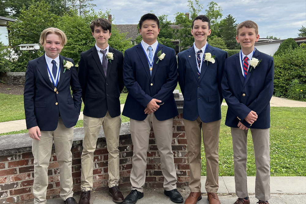 5 young men at graduation