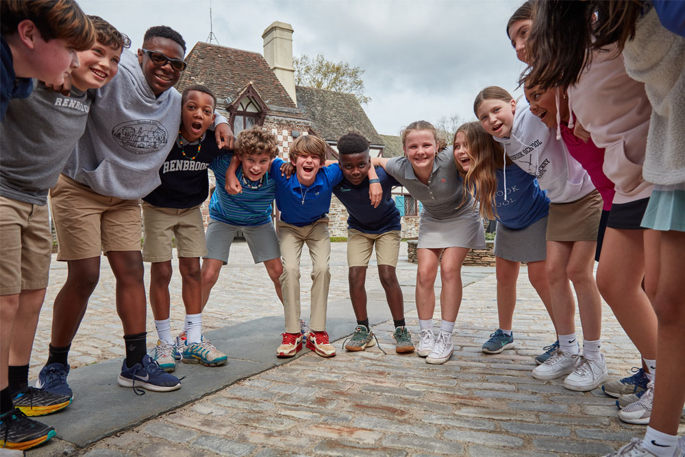 Upper school students gathered in a friendly huddle