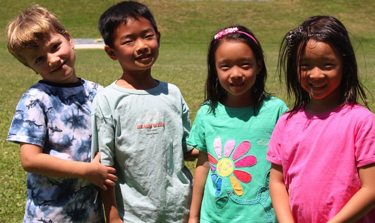 Group of four diverse children