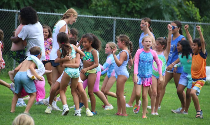 Group of excited campers in bathing suits