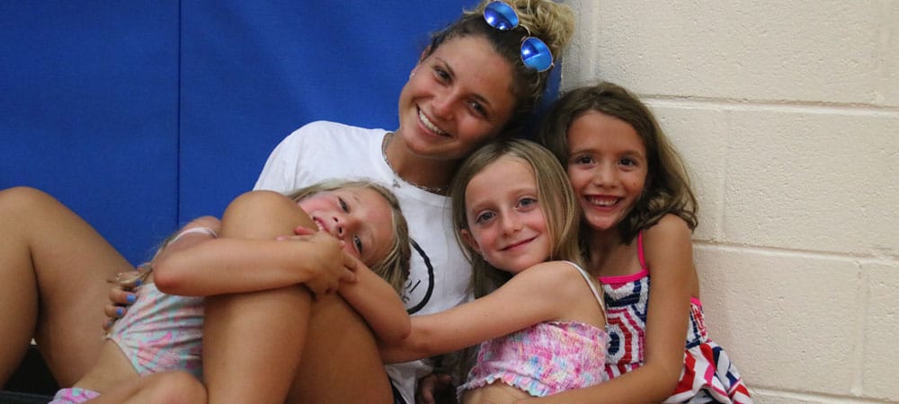 Camp Counselor and three girls cuddled up