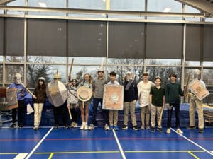 middle school Latin students displaying projects for Gladiator Games