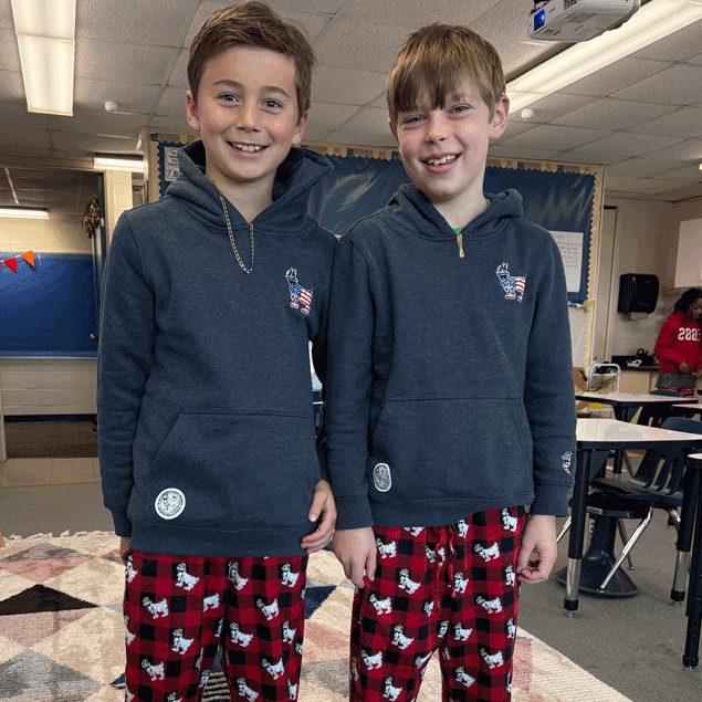 two young boys wearing the same outfit