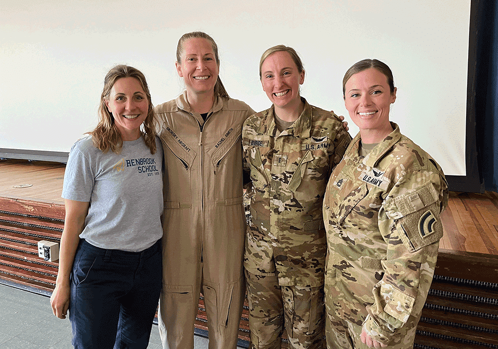 Group of three female pilots with STEM teacher