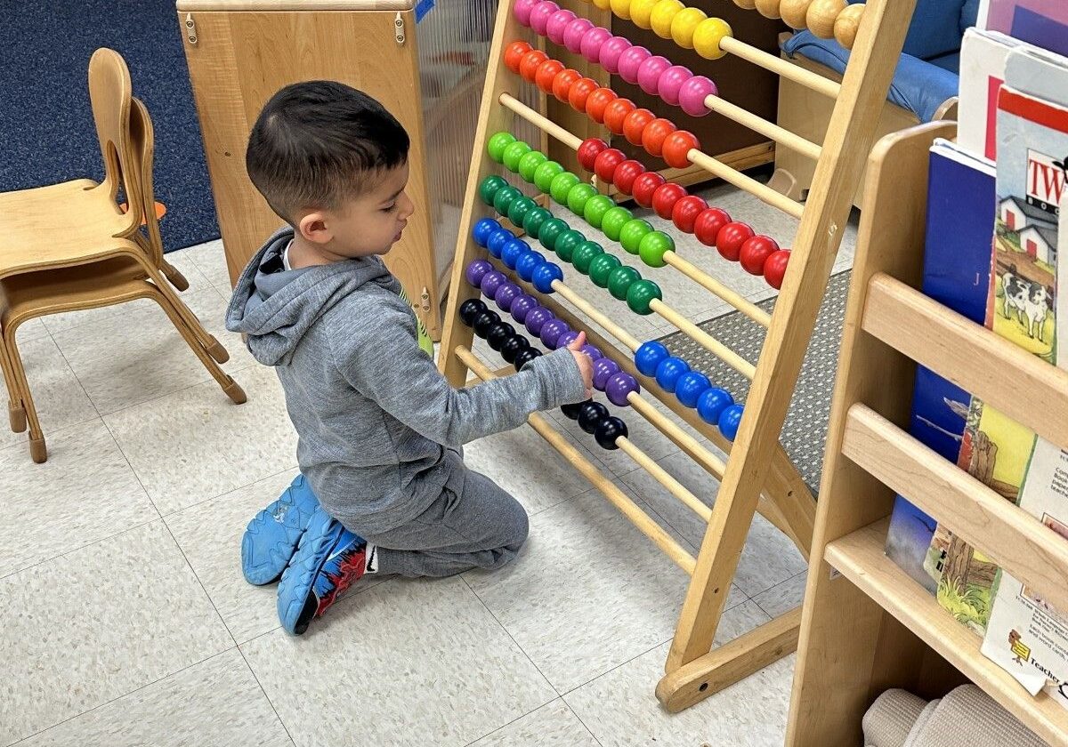 boy working with abacus