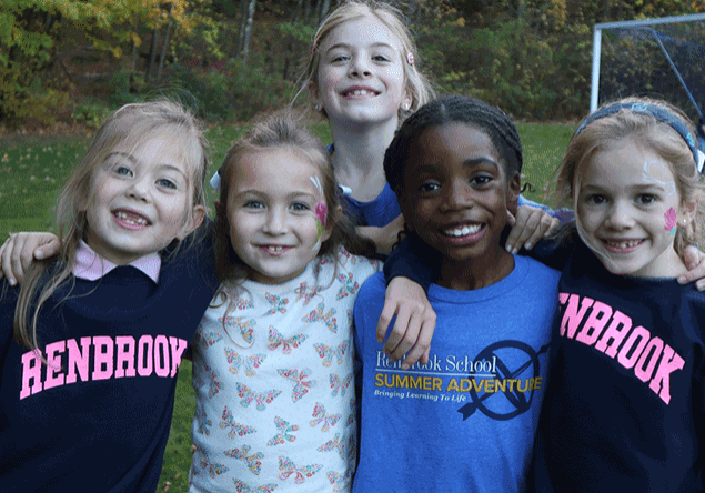 group of 5 diverse elementry age girls posing together